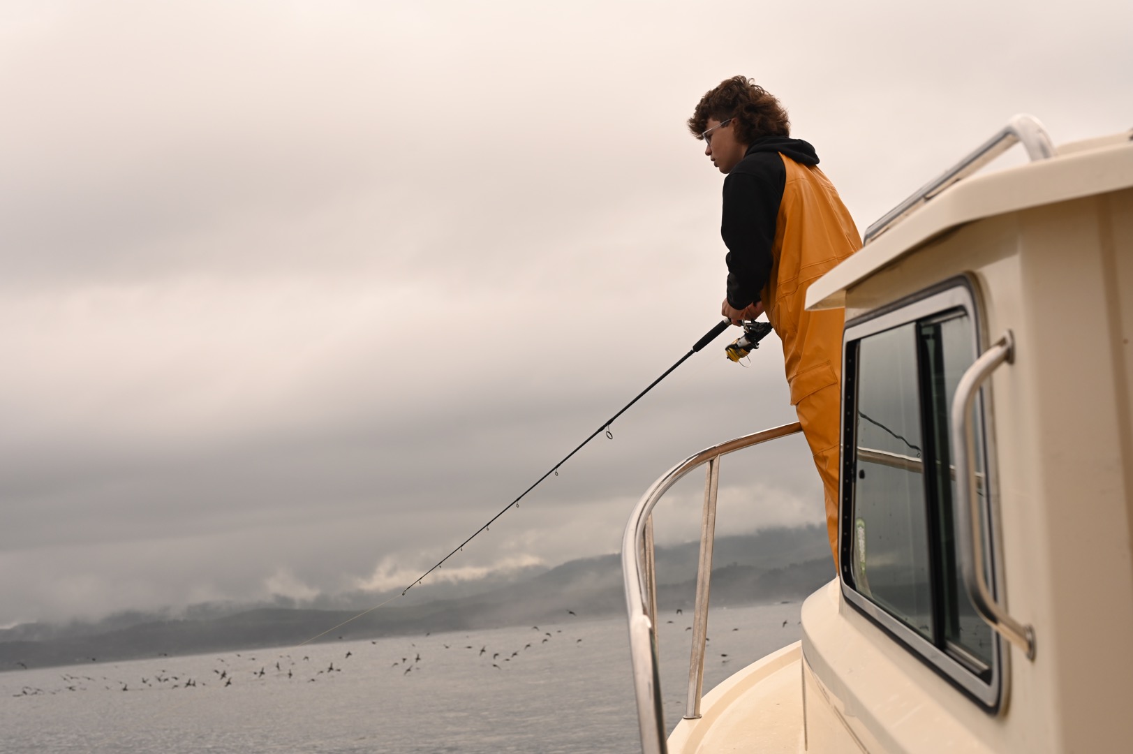 fishin goff the back of the boat